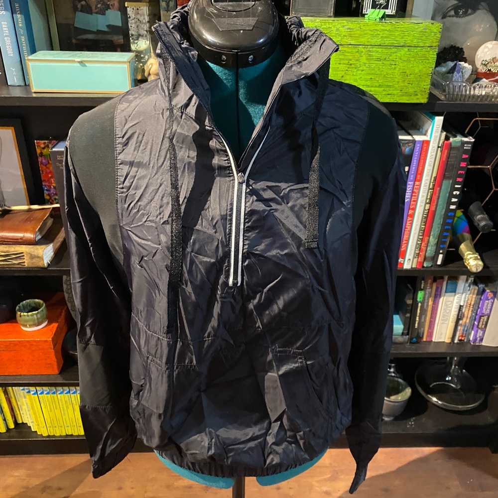 Quarter zip windbreaker from fabletics with mesh detailing and silver piping
